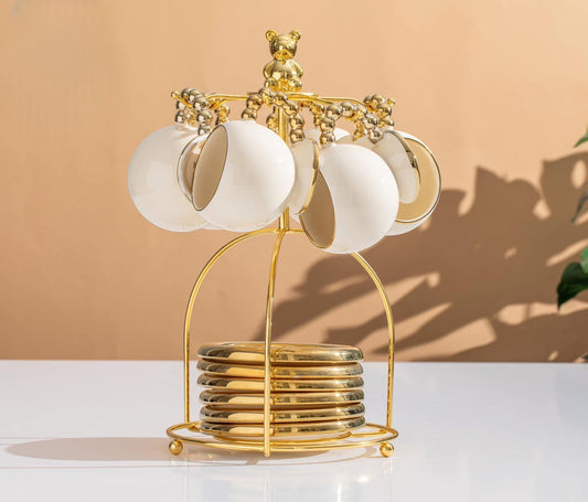 طقم شاي بورسلين أبيض مدهب بيد دهبي بابلز – 13 قطعة مع حامل استيل جولد دبدوب