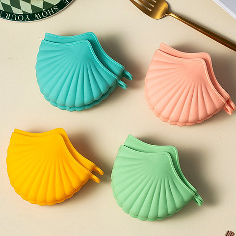 قفازات سيليكون صغيرة مقاومة للحرارة بشكل صدفة للفرن – زوج من الملاقط