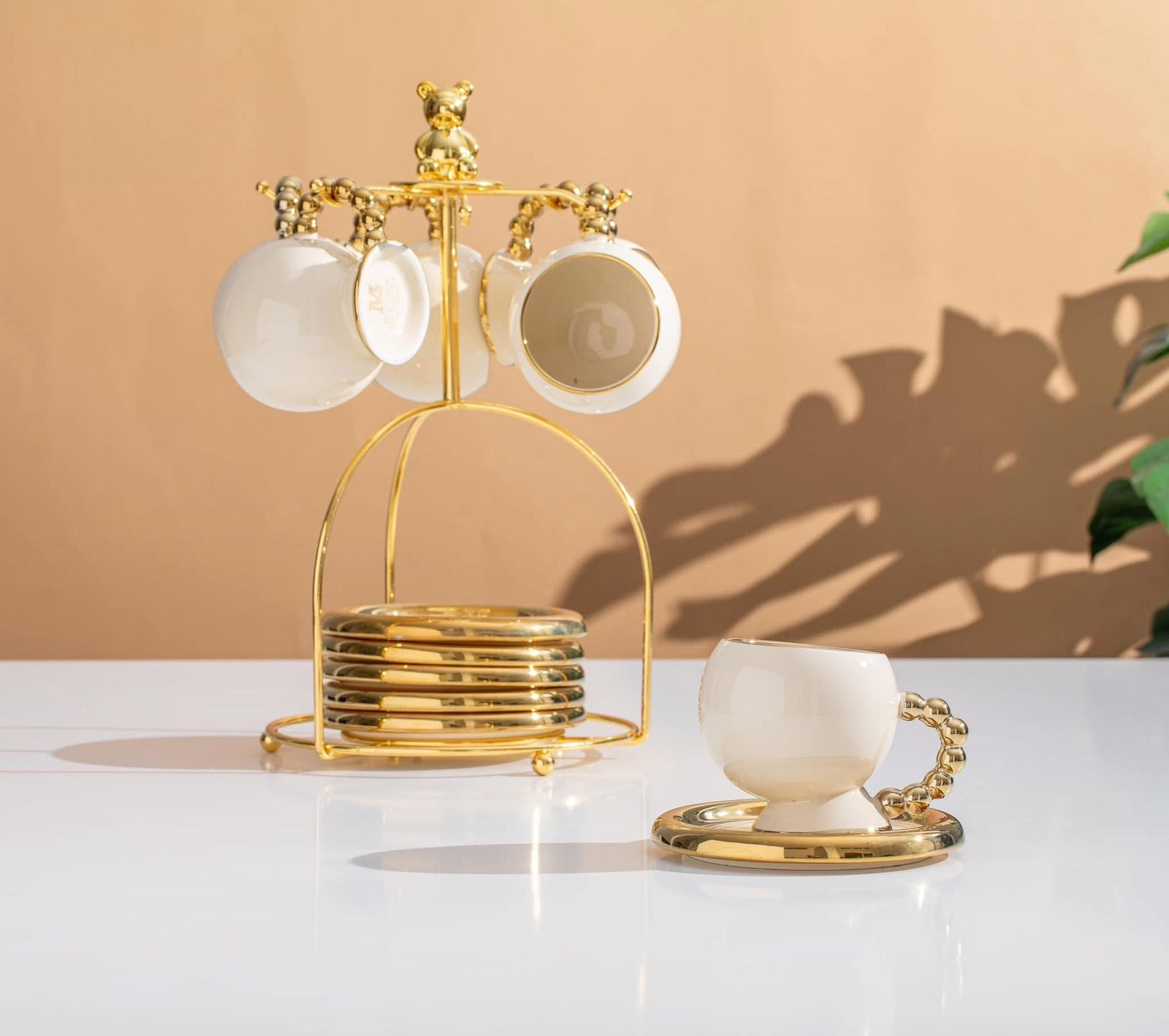 طقم شاي بورسلين أبيض مدهب بيد دهبي بابلز مستورد 13 قطعة مع حامل استيل جولد دبدوب فاخر